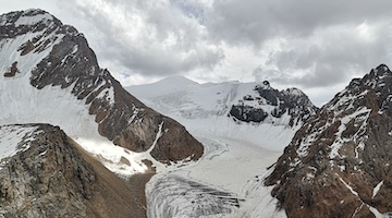 Komsomol peak (left) and a glacier