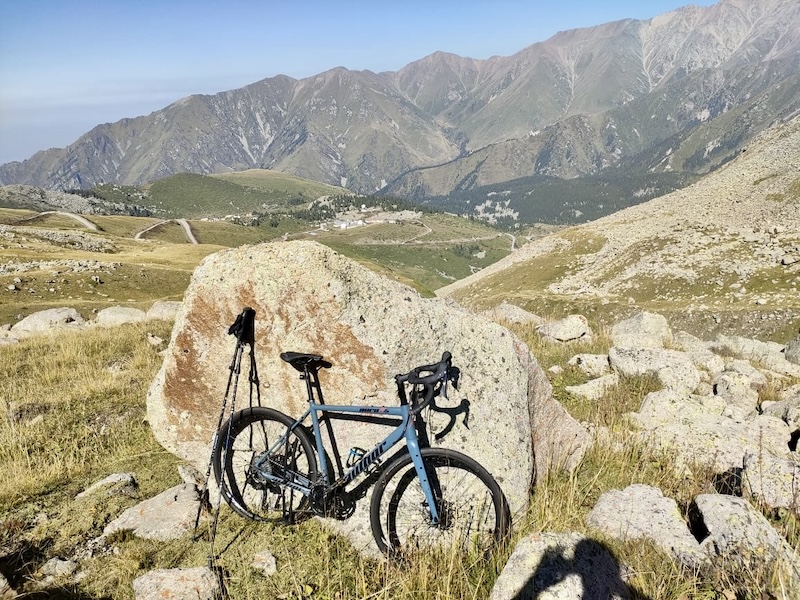 Gravel bike on a rocky mountain trail overlooking the Big Almaty Gorge, Zailiyskiy Alatau