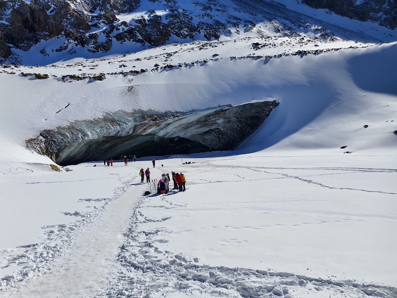 entrance to Oktyabrskaya cave on Bogdanovich glacier