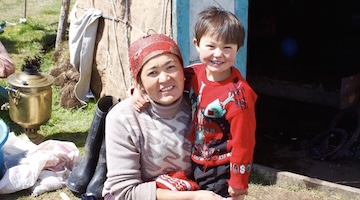 family of nomads near yurt