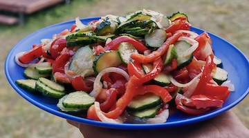 Fresh vegetable salad served at a remote mountain campsite in Kazakhstan